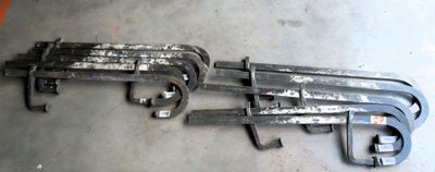 two wrenches are laying on the floor next to each other