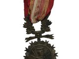 une vieille médaille ornée d'un ruban et d'une étoile