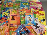 a pile of children ' s books on a table