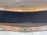 a small wooden table with a drawer underneath it