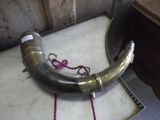 a metal pipe that is sitting on a table