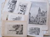 many pictures of old buildings and buildings on a table