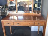an image of a wooden dressing table with three mirrors on top of it