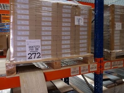 a large stack of boxes on a shelf in a warehouse