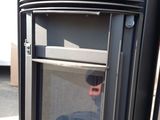 a close up of a black stove with a glass door