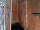 a wooden box with a door open on the floor