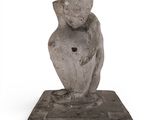 an image of a statue of a man sitting on top of a stone block