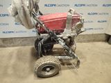an image of a small tractor with a trailer attached