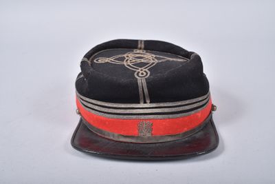 an image of a black hat with a red band and a cross on it
