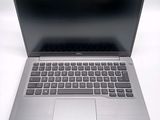 an open laptop computer sitting on top of a white table