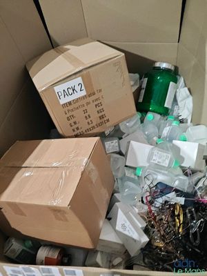 a cardboard box full of assorted items in a room