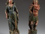 paire de figurines en bois sculpté représentant une femme et un homme