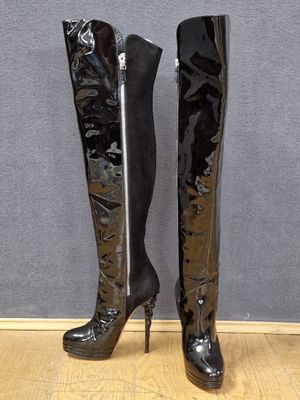 black high heeled boots with a zipper on the side