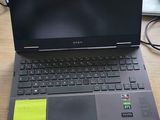 a laptop computer sitting on top of a wooden desk