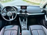 a car dashboard with a steering wheel and a dash board