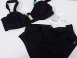 a close up of a bikini and panties on a white surface
