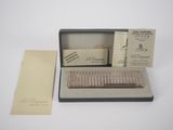 an image of a box with a razor in it on a white surface