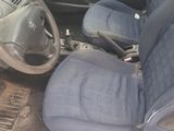 a picture of a car with blue seats and a steering wheel
