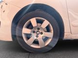 a close up of a car ' s tire on the street