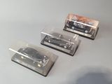 three miniature cars that are sitting on a table