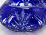 pair of cobalt blue glass vases on a white surface