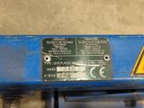 a close up of a sign on a blue machine
