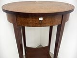 une image représentant une table ronde sur laquelle se trouve un tiroir