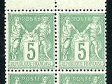 a green and white stamp with a picture of a woman on it