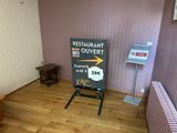a sign in the corner of a room that says restaurant ouvertt