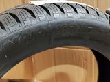 a close up of a tire on a cardboard box with a box in the background