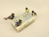 three birds sitting on the edge of a dish