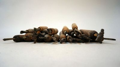many bottles of wine sitting on top of each other