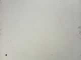 a picture of a white refrigerator in a room