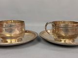 paire de tasses à thé et soucoupes anciennes en métal argenté