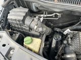 a close up of a car ' s engine with the hood open