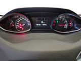 a close up of a car dashboard with a speedometer and gauges