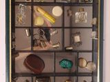 a picture of a display case with various items in it