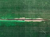 a close up of a piece of green fabric on a table