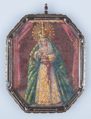 an old picture of a woman in a green dress holding a baby