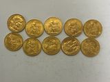a bunch of gold coins sitting on top of a table