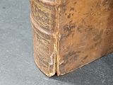 an old book that is sitting on a table