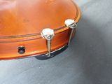 a close up of a guitar case on a table