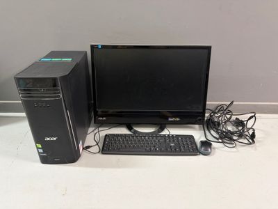 a desktop computer sitting on a desk with a keyboard and mouse