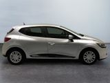 the silver car is parked on the concrete floor in the room