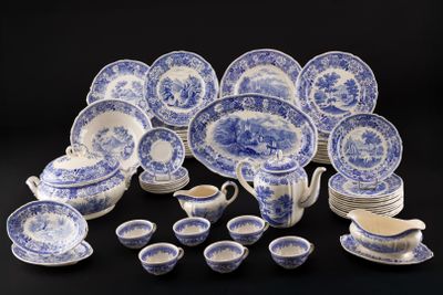 an assortment of blue and white china dishes and cups and saucers