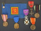 many medals and medals displayed on a blue cloth