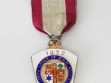 a close up of a medal with a ribbon around it