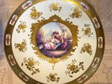 a plate with a picture of a woman and a child on it
