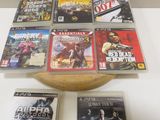many video games sitting on a table with a bowl of them