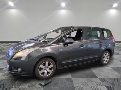 a picture of a gray minivan parked in a garage